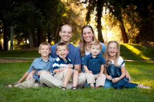 Loving Couple Embracing At Sunset Wallpaper