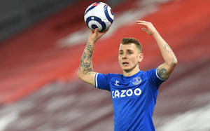 Lucas Digne Holding A Football Wallpaper