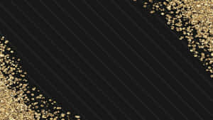Luxurious Black And Gold Desktop With Sleek Surface Wallpaper
