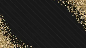Luxurious Black And Gold Desktop With Sleek Surface Wallpaper