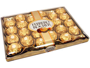 Luxurious Gold Foil Wrapped Chocolates. Wallpaper