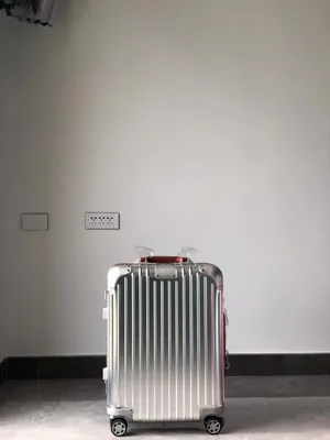 Luxurious Travel With Rimowa Original Cabin S Suitcase Wallpaper
