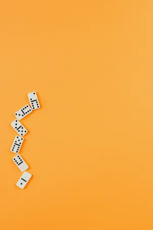 Lying Down Dominos Wallpaper