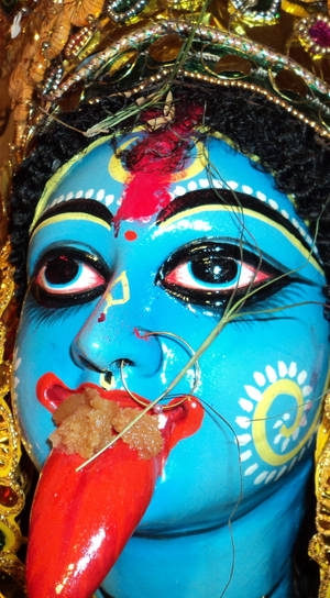 Maa Kali Blue Statue With Tongue Close-up Wallpaper