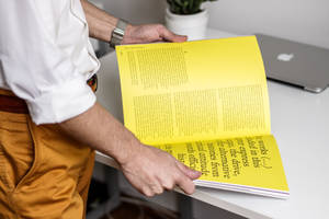 Magazine With Bright Yellow Pages Wallpaper