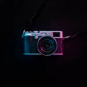 Magnificent Photography Camera Illuminated By Enchanting Purple Light Wallpaper
