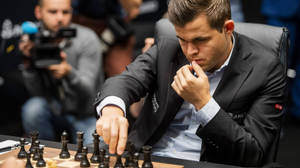 Magnus Carlsen Black Chess Pieces Wallpaper
