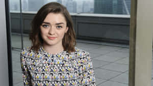 Maisie Williams Posing In A Candid Close-up Wallpaper