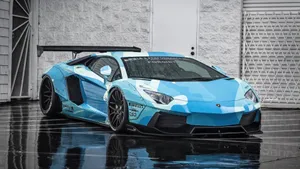 Majestic Blue Lamborghini Aventador Flaunting Its Powerful Stance Wallpaper
