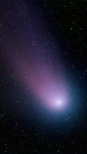 Majestic Comet In The Night Sky Wallpaper