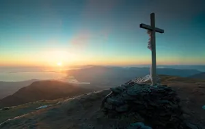 Majestic Cool Cross Against A Captivating Celestial Background Wallpaper