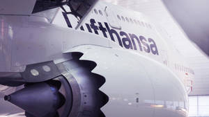 Majestic Lufthansa Airbus In Full Flight Wallpaper