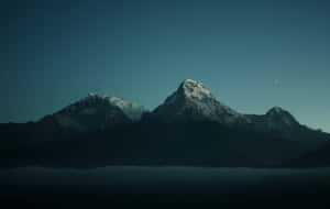 Majestic Mountain Scenery Fills The Sky Wallpaper