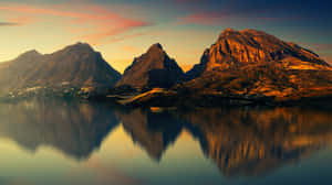 Majestic Mountains Reflected On Water Wallpaper