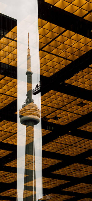 Majestic Reflection Of The Iconic Cn Tower Wallpaper