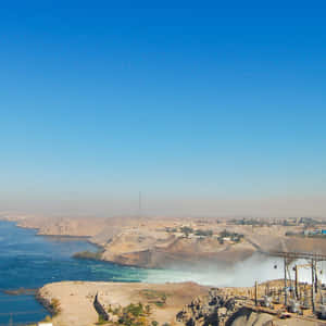 Majestic View Of Aswan High Dam In Egypt Wallpaper