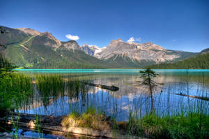 Majestic View Of The Emerald Green Lake Wallpaper