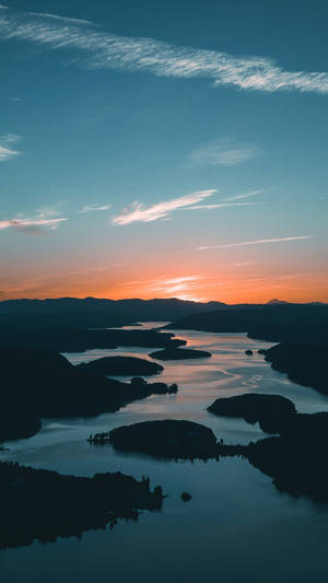 Majestic View Of The River Leading Towards The Horizon Wallpaper