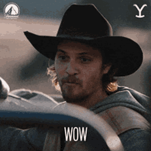 Majestic View Of Yellowstone's Geysers And Mountains Wallpaper