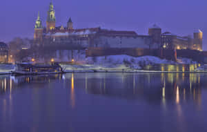 Majestic Wawel Castle On A Crisp Winter Evening Wallpaper