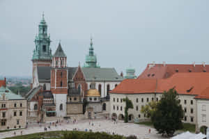 Majestic Wawel Castle Under Gray Skies Wallpaper