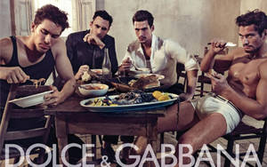 Male Dolce And Gabbana Models Around A Table Wallpaper