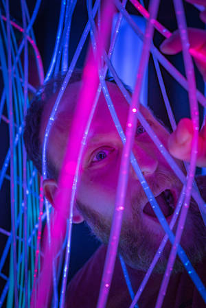 Man Behind Bright Lights Neon Iphone Wallpaper