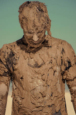 Man Covered In Mud Wallpaper