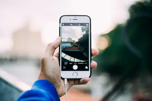 Man Doing Photography Using Iphone Wallpaper