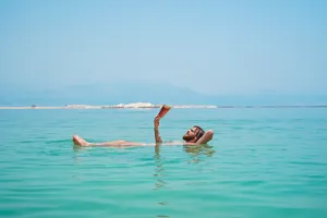 Man Floating At Sea Wallpaper