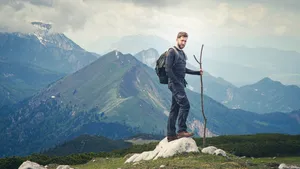 Man Hiking In Slovenia Wallpaper