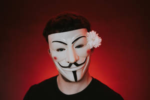 Man In Hacker Mask With Flower Wallpaper