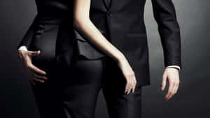 Man In Suit Touching Woman Wallpaper