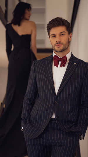 Man In Suit With Red Bowtie Wallpaper