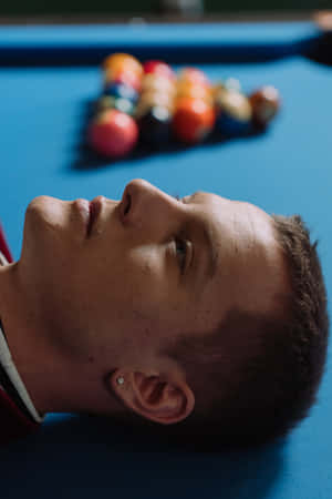 Man Lying On Pool Table Wallpaper