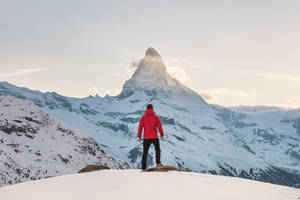 Man On Snowy Mountain Macbook Wallpaper