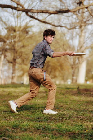 Man Playing Frisbee Wallpaper