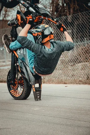 Man Riding A Ktm Rc 390 Wallpaper