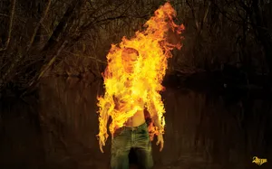 Man Standing On Fire Wallpaper