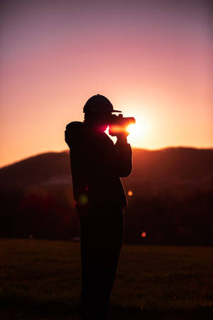 Man Taking Photo During Sunset Photography Wallpaper
