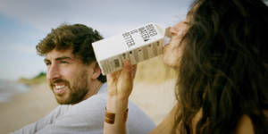 Man With Woman Drinking Water From Box Wallpaper