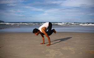 Man Yoga In Beach Shore Wallpaper