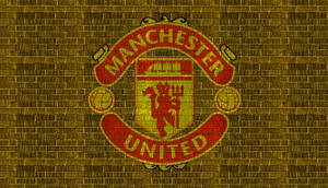 Manchester United Logo In Yellow Brick Wallpaper