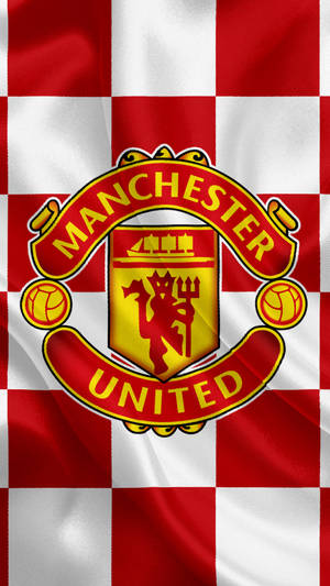 Manchester United Logo With Checkered Pattern Wallpaper