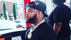 Manin Black Capand Gold Chain Wallpaper