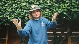 Manin Blue Sweaterand Bucket Hat Wallpaper