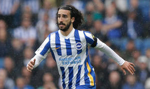 Marc Cucurella In Action On The Soccer Field Wallpaper