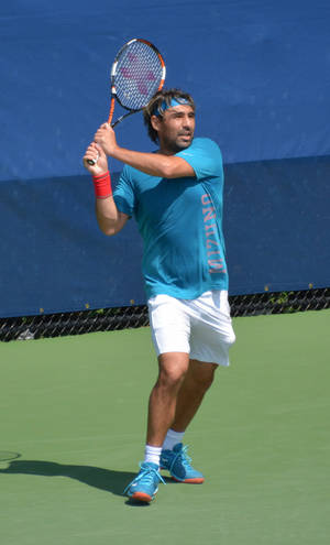 Marcos Baghdatis In Action - Swinging Racket Wallpaper