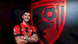 Marcos Senesi With Afc Bournemouth Logo Wallpaper