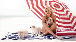 Margot Robbie With Puppies Wallpaper